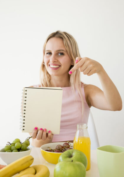 blonde-influencer-showing-notebook