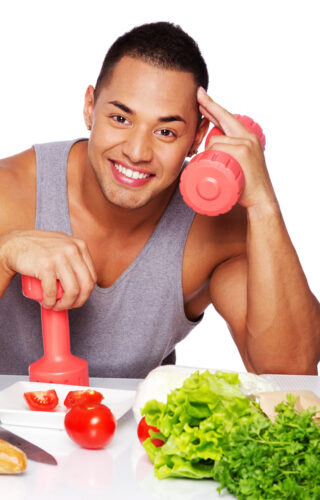 a man holding weights and smiling